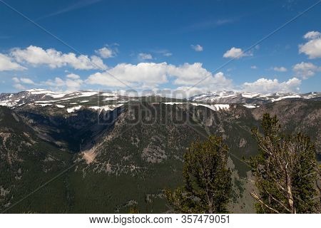 A Landscape Of Montana Mountains Still Covered In Patches Of Snow In Summer As Seen From The Beartoo