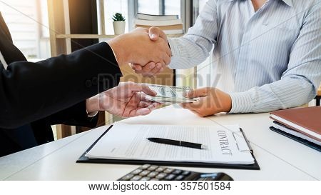 Bribery And Corruption, Businessman Hand Giving Money And Receive In The Envelope Offered File Disho