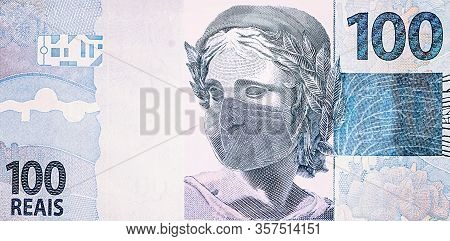 One Hundred Reais Bill With Disposable Medical Mask. Concept Of The Coronavirus Epidemic In Brazil. 