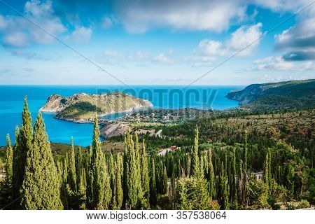Frourio Peninsular And Assos Village With Beautiful Cypress Trees In Foreground. Kefalonia Island, G