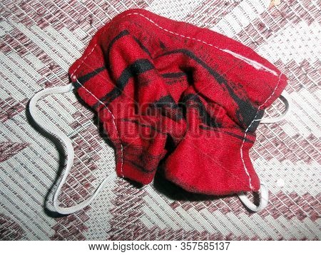 A Cloths Mask Throw Into The Bed
