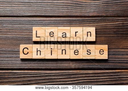 Learn Chinese Word Written On Wood Block. Learn Chinese Text On Table, Concept