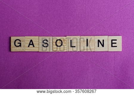 Word Gasoline From Wooden Letters Lies Red Backgound