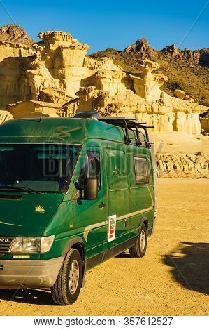 Bolnuevo, Spain - March 15, 2019: Camper Van On Parking Area At Eroded Yellow Sandstone Formations, 