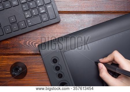 The Hand Draws On A Graphics Tablet. Freelance, Designer, Illustrator. Technology, Remote Work, Outs