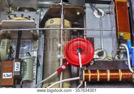 Inside View Of High Frequency Power Amplifier With Capacitors, Coils And Other Components