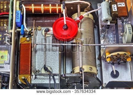Inside View Of High Frequency Power Amplifier With Capacitors, Coils And Other Components