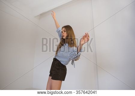 Young Beautiful Girl Is Dancing In The Style Of Contemp.
