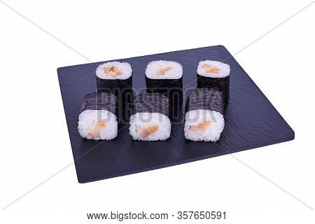 Traditional Fresh Japanese Sushi Maki On Black Stone Maki Escolar On A White Background. Roll Ingred