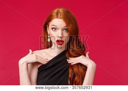 Close-up Portrait Of Shocked Gorgeous Redhead Woman Look With Disbelief And Shook, Questioned Pointi