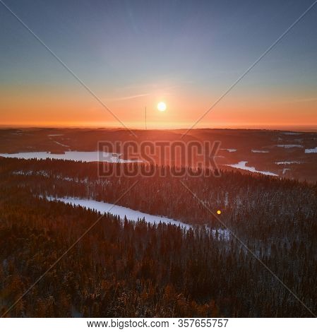 Aerial View Of Hill Ukko In The National Park Koli Finland Against An Amazing Sunset.