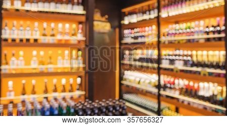 Background Blurred Defocused Beers Are Cooling In Fridge, Freezer Or Refrigerator Shelf. Defocused B