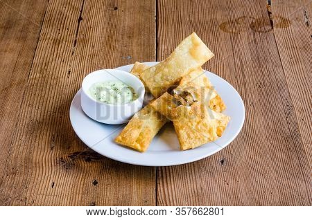 Latin-american Appetizers Called Tequenos Made Of Fried Wonton Filled With Cheese And Is Served With