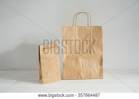 Packages Of Environmentally Friendly Material. Eco-packing. Kraft Packages Of Two Sizes.