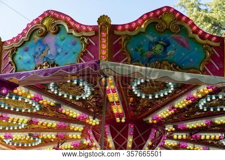 Multicolored Lights And Decoration Of A Carousel At Sunny Afternoon At Jugendfest Brugg 2019.