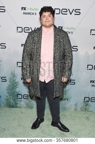 LOS ANGELES - MAR 02:  Harvey Guillen Harvey Guillen arrives for FXâs Limited Series âDevsâ Los Angeles Premiere on March 02, 2020 in Hollywood, CA