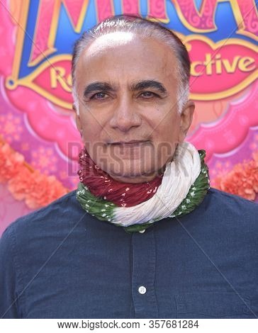 LOS ANGELES - MAR 07:  Iqbal Theba arrives for âMira, Royal Detectiveâ World Premiere on March 07, 2020 in Burbank, CA