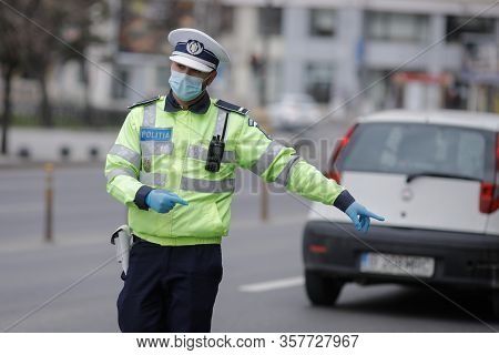 Romanian Road Police Officer Pulls Over A Car To Check For The Driver’s Identity Papers.