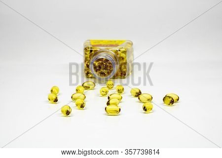 Fish Oil Softgel Golden Capsules Isolated On White Background