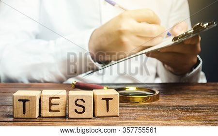 Man Makes A Test And Writes Results To A Paper Tablet. Quality Control, Organization Process Managem