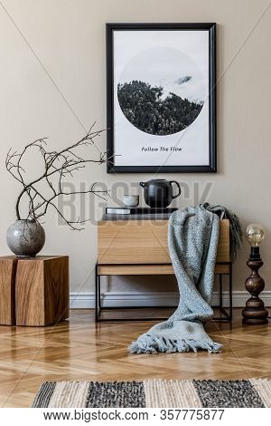 Modern Scandinavian Living Room Interior With Black Mock Up Poster Frame, Design Commode And Elegant
