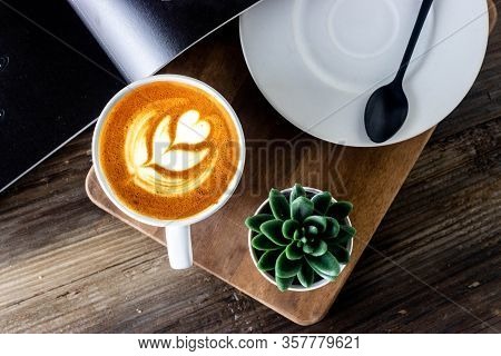 Latte Art Capuccino Widh Plate And Spoon On Wooden Table. Flat Lay Coffee