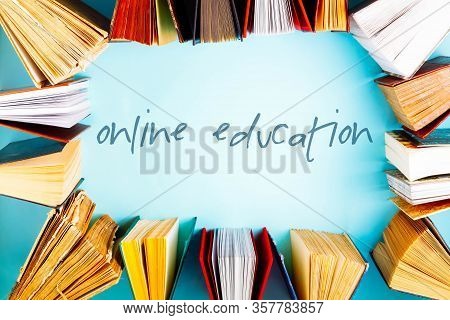Flat Lay Frame Of Old Books On Blue Background, Online Ducation Concept