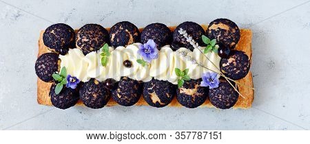 Dessert Saint Onore. Berry Pie. Puff Pastry Tart With Profiteroles, Butter Cream, Black Currant Jam 