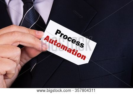 Businessman Putting A Card With Text Process Automation In The Pocket