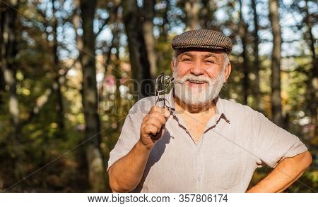 Eye Care. Happy Pensioner Hold Glasses In Nature. Old Man Have Long Sight. Old Age Sight. Failing Si