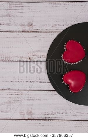 Close-up Of Mousse Cake With Red Mirror Glaze. Cooking French Dessert. Frozen Mirror Icing On The Ca