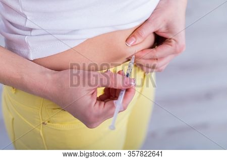 Close-up. An Unrecognizable Woman Prepares For Ivf And Injects Hormones Into Her Stomach. Faceless G