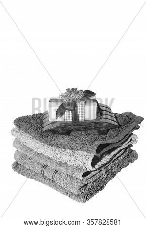 Soap And Dish On Top Of Facecloths Of Various Shades