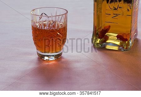 Bakhmut, Ukraine, March, 2020. Vodka With Pepper In A Branded Bottle And A Glass Of Vodka.
