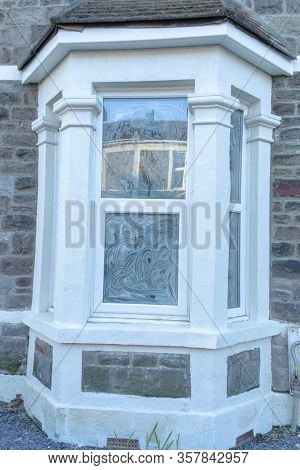 A Close Up View Of Windows That Have Been Covered Up So That Indoor Renervations Can Take Place