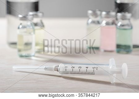 5ml Syringe And Vials On White Table, Selective Focus