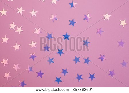Pink And Purple Shiny Star Confetti Over Pink Background. Star Confetti.