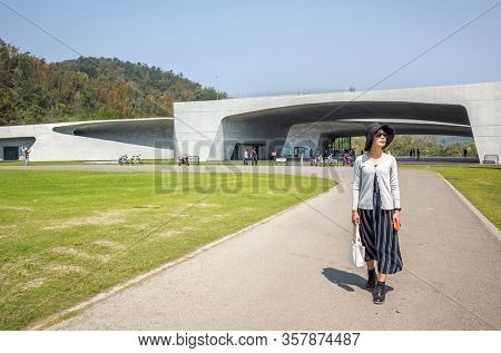 traveling woman walk at Xiangshan Visitor Center, Sun Moon Lake, Nantou, Taiwan