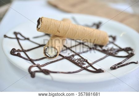 Wafer Roll With Condened Milk. Coffee Desserts. Delicious Dessert With Coffee.