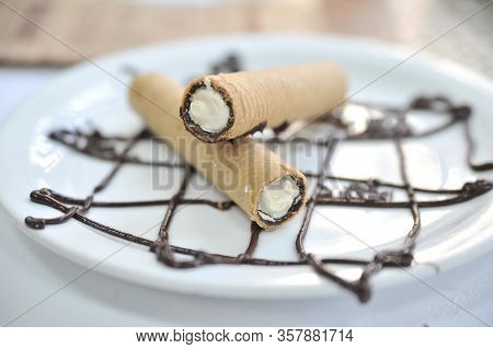 Wafer Roll With Condened Milk. Coffee Desserts. Delicious Dessert With Coffee.