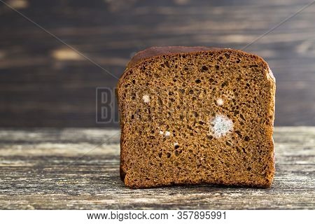 Pieces Of Black Rye Bread, Close-up Of Food On A Wooden Table, There Is Mold On The Pulp