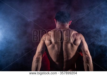 Muscular Man Showing Muscles Isolated On The Black Background. Concept Of Goal, Afford, Creation You