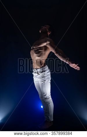 Muscular Man Showing Muscles Isolated On The Black Background. Concept Of Goal, Afford, Creation You