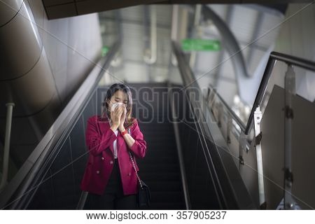 Asian Girl Use A Protection Mask For Prevent Pm 2.5 And Corona Viruus Or Covic 19 In Office In Bangk