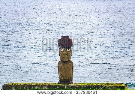 Ahu Ko Te Riku Moai With Eyes In Rapa Nui Against The Ocean