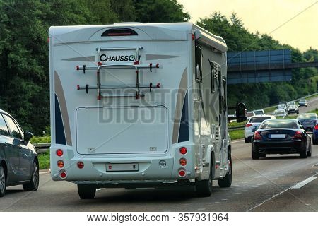 Motorway A 61; Germany - August 13; 2017:
Motorhome On The A 61 Motorway In Tourist Traffic Near The