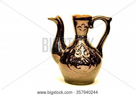 Asian-style Jug In Brown Glaze On A White Background
