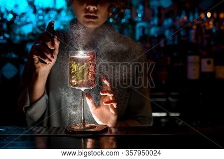 Woman Bartender Actively Sprinkles On Glass With Fresh Pink Cocktail.