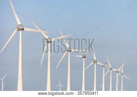 Wind Turbine From Aerial View, Drone View At Windpark Westermeerdijk A Windmill Farm In The Lake Ijs