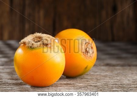 Fruit Of Lulo Or Naranjilla On Wood